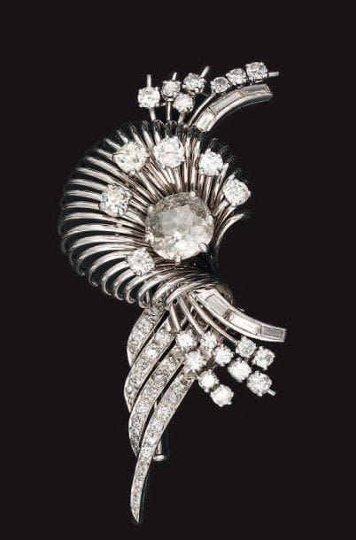 Clip de revers en platine stylisant une fleur...