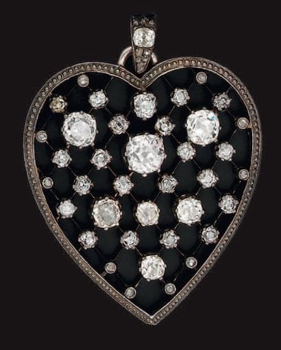 Pendentif coeur en or et argent ajouré, serti...