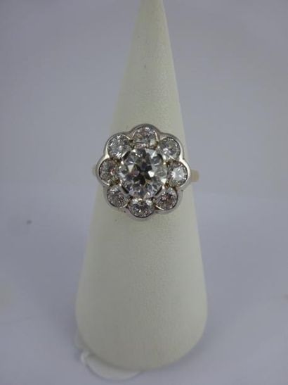 Bague marguerite en ors blanc et jaune (750)...