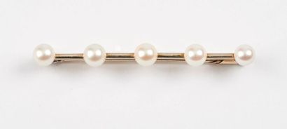 Broche ligne en or gris (750) ponctuée de...