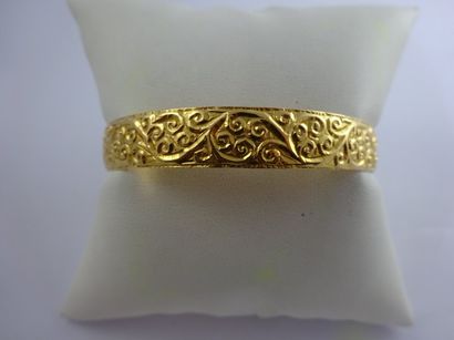 

Bracelet jonc en or jaune (750) à motif...