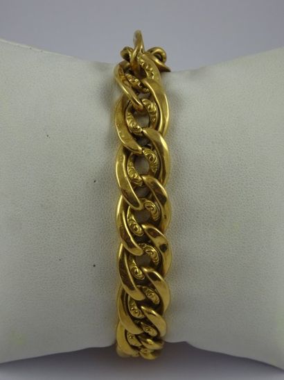 

Bracelet gourmette en or jaune (750). Fermoir...