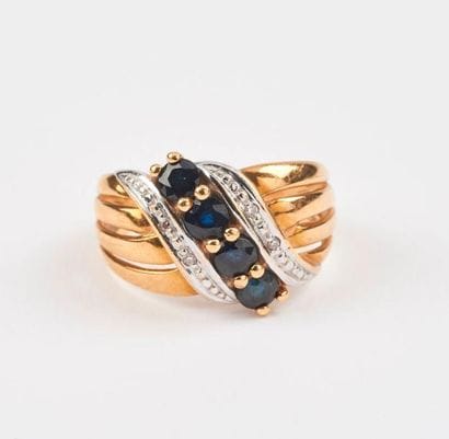 Bague en ors jaune et gris (750) ornée d'une...