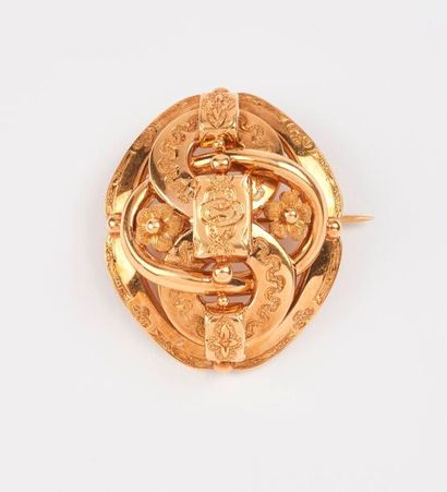 Broche en or jaune (750) ajourée formée d'anneaux...