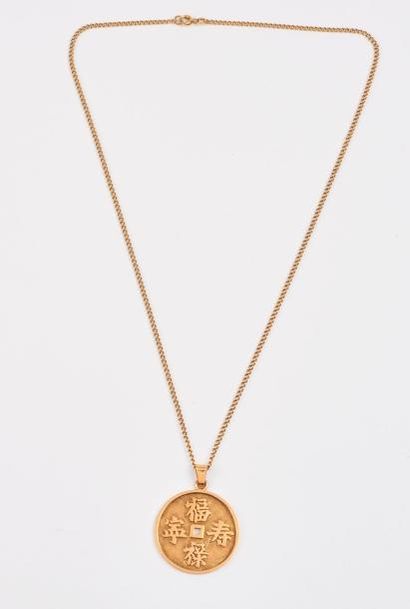 Chaîne et pendentif rond en or jaune (750)...