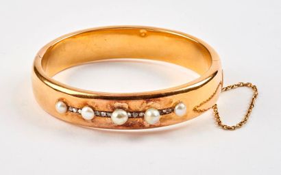 Bracelet jonc ouvrant en or jaune (750) creux,...