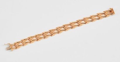 Bracelet en or jaune (750) à maillons articulés...