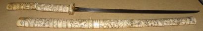 JAPON

Katana en os sculpté. 

Début XXème...