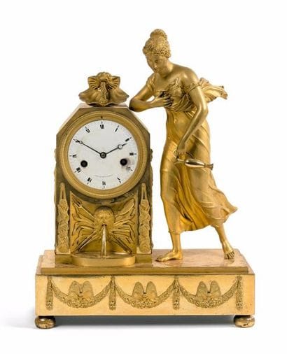 Pendule borne en bronze doré au mat et au...