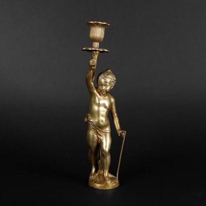Flambeau en bronze doré.

Un chérubin, sur...