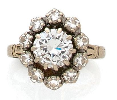 Bague marguerite en or gris (750) centrée...