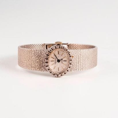 NYLUX 


Montre de dame en or gris (750).

Lunette...