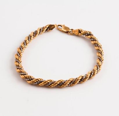 Bracelet torsadé en ors jaune et gris (750)

Fermoir...