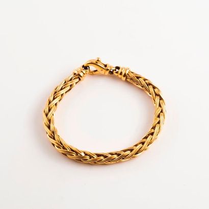 Bracelet en or jaune (750) à maille palmier....