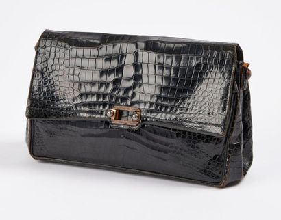 DUNHILL


Sac de dame en cuir noir façon...
