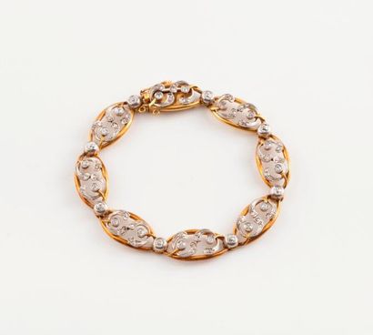 Bracelet articulé en ors jaune et gris (750)...