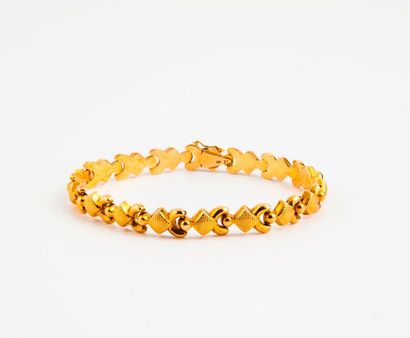 Bracelet articulé en or jaune (750) à motif...