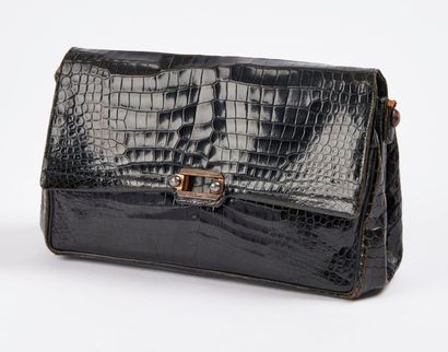 DUNHILL


Sac de dame en cuir noir façon...