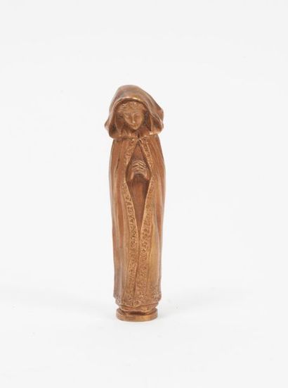 Cachet en bronze figurant une orante.

Signature...