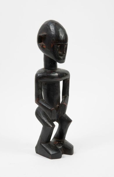 MALI

Statuette en bois sculpté et patiné...