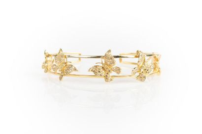 Bracelet rigide ouvrant en or orné de 5 papillons...