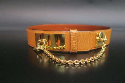 CELINE. 2 ceintures, l'une en cuir gold (boucle...