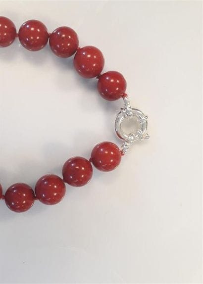 Collier fantaisie teinté corail, fermoir...