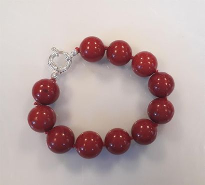 Bracelet fantaisie teinté corail, fermoir...
