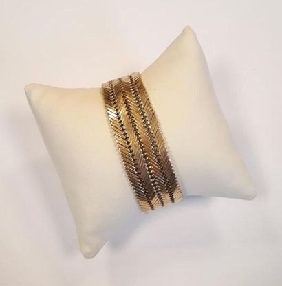 Bracelet manchette souple en or tressé, années...