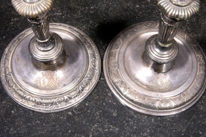 Deux flambeaux en bronze argenté à décor...