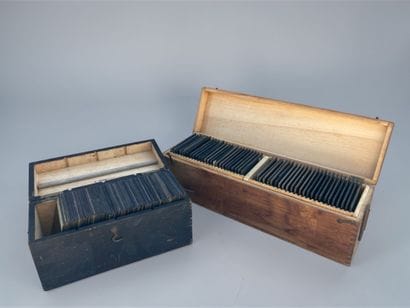 In wooden boxes, a collection of nearly 120...
