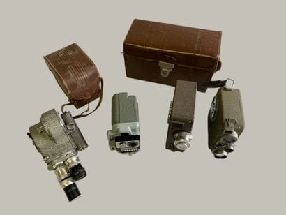 Set of four assorted cameras. In a case:...