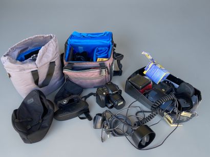 A collection of assorted photography equipment,...