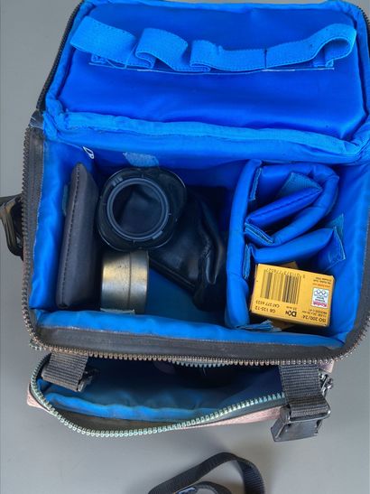 A collection of assorted photography equipment,...