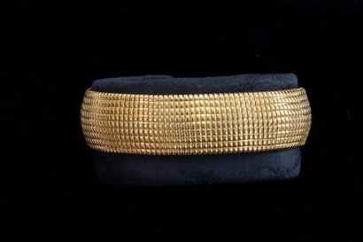 Bracelet souple en or jaune 18k (750 millièmes),...