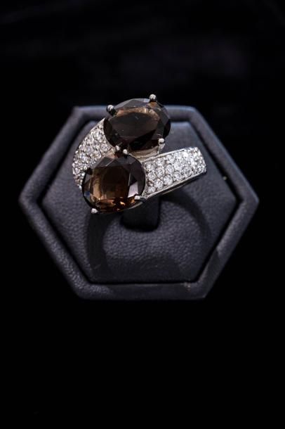 Une bague toi et moi en argent (800 millièmes)...
