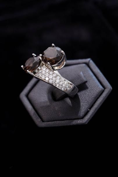 Une bague toi et moi en argent (800 millièmes)...