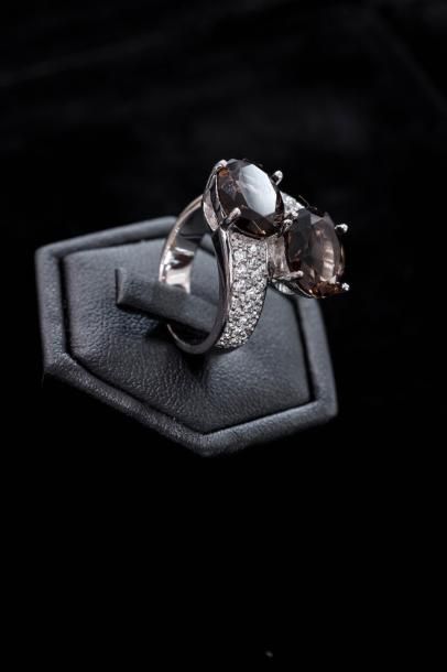 Une bague toi et moi en argent (800 millièmes)...