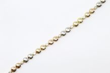 FRED 

Bracelet en or jaune et gris 18K (750)...