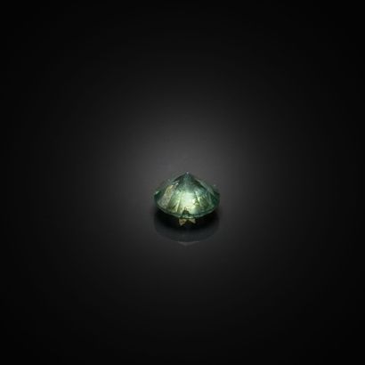 Diamant bleu/vert rond sur papier. 
Dimensions...
