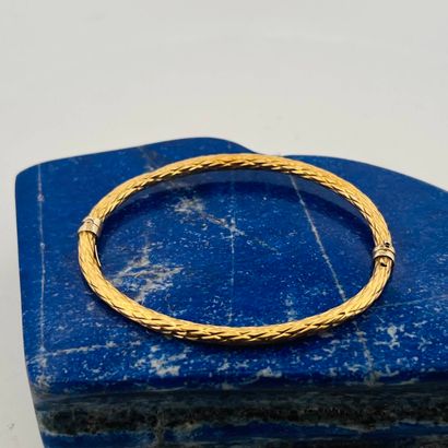 Jonc ouvrant en or jaune et gris 18K (750)...