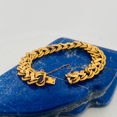 Gourmette en or 18K (750) à maille américaine...