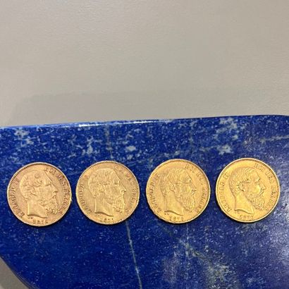 Quatre pièces en or (900) de 20 Francs Léopold...