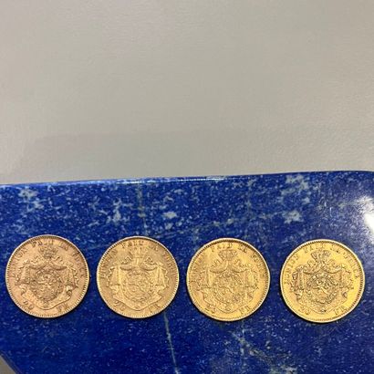 Quatre pièces en or (900) de 20 Francs Léopold...