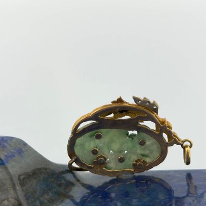 Pendentif en or jaune 18K (750) stylisant...
