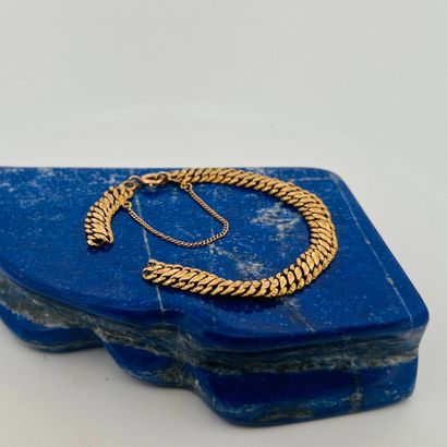 Débris de bracelet en or 18K (750). 
Poids...