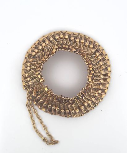 Bracelet souple en or jaune 18K (750) formés...