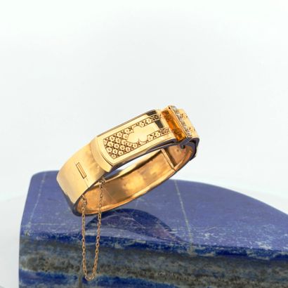 Jonc ouvrant en or 18K (750) appliquant d'un...