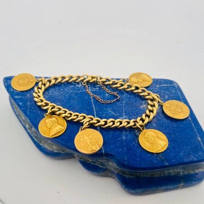 Bracelet en or jaune 18K (750) à maille gourmette...