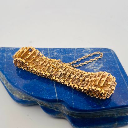 Bracelet souple en or jaune 18K (750) formés...